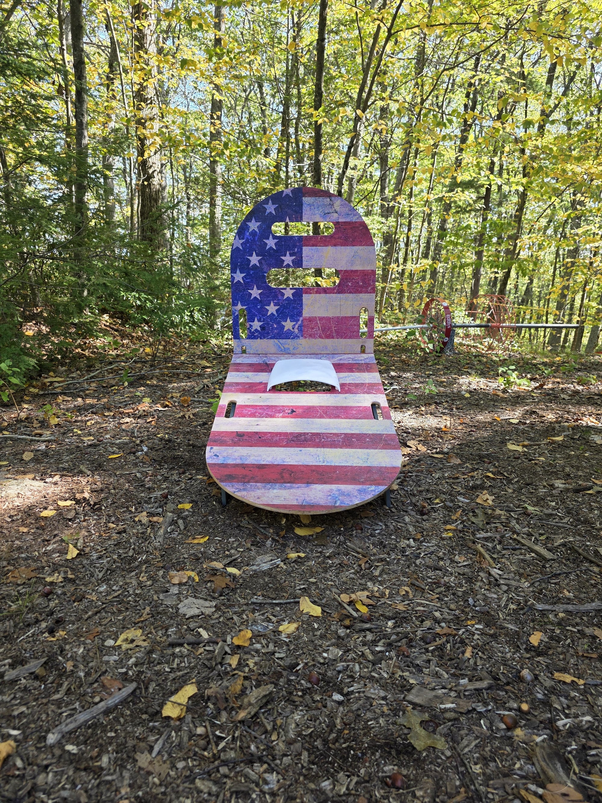 lotShot backyard game board with American flag design set up outdoors